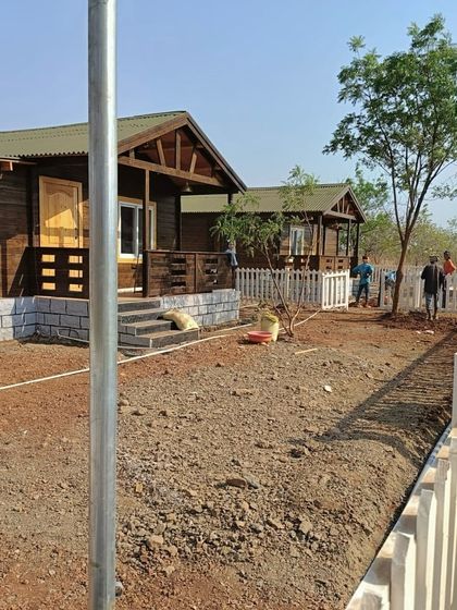 Work underway at the farmhouse site, with the ground leveled and ready for the next stage of landscaping.
