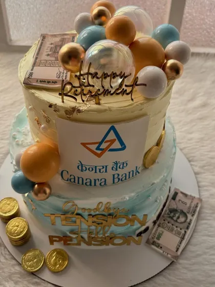 "Goodbye Tension, Hello Pension!" This two-tier retirement cake for a Canara Bank employee is all about celebrating the good times ahead, complete with edible money and gold coins.