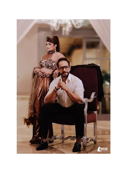 A powerful and stylish portrait of a couple. The confident poses and regal setting create a look of modern royalty.