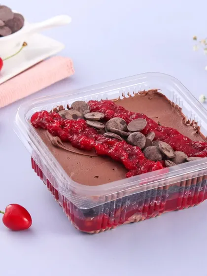Our Chocolate Cherry dessert tub is a rich and decadent option. It features layers of chocolate cake, chocolate mousse, and a sweet cherry filling, topped with chocolate chips.