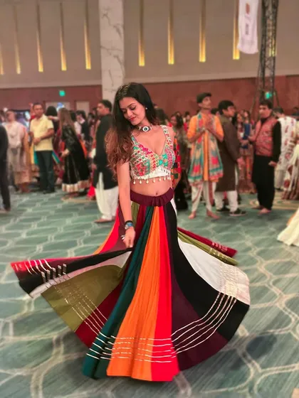 The perfect twirl in my colorful chaniya choli during a Garba night. This picture captures the pure joy and vibrant energy of dancing, which is the core of all my fitness sessions, especially my Navratri specials.