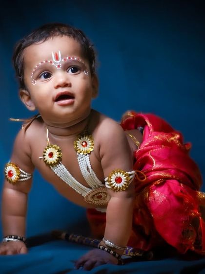 Capturing the playful side of 'Baby Krishna' as he crawls. This dynamic pose adds a sense of life and movement to the themed photoshoot.