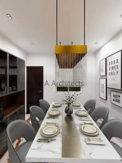 A concept for a sophisticated dining area, featuring a marble-top table, modern chandelier, and a gallery wall. This design focuses on creating an elegant space for family meals.