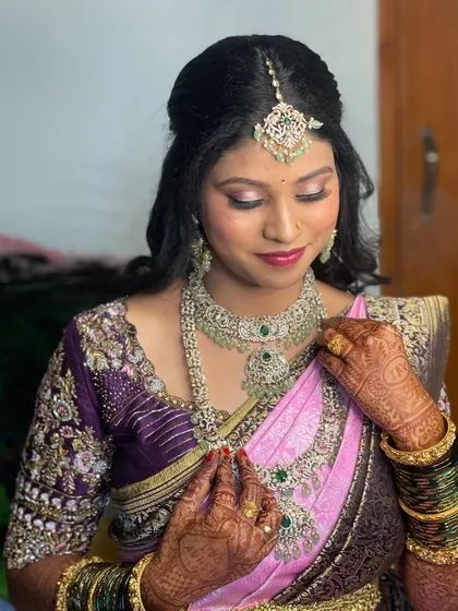 A close up of this bride's reception makeup. I used soft pink and silver tones on her eyes to match the diamond jewellery and her pink saree.