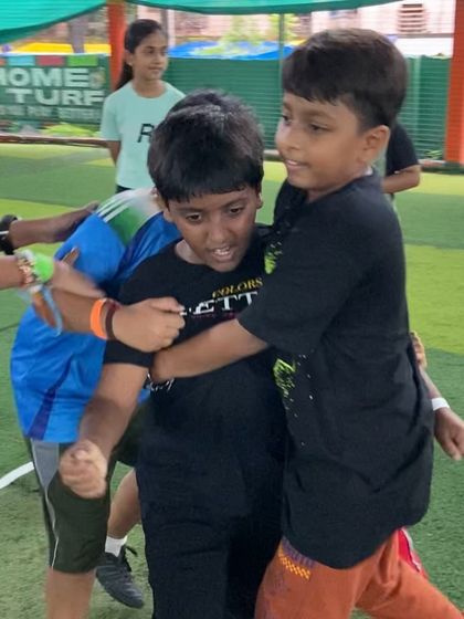 A friendly tackle during a game of Kabaddi. These moments of playful competition help build resilience, sportsmanship, and strong friendships among the kids.