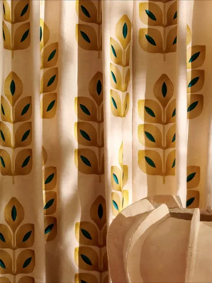 A detailed shot of the embroidered linen drapery from Élitis. The clean lines of the motif and the texture of the fabric showcase a design that is both modern and rooted in timeless artistic expression.