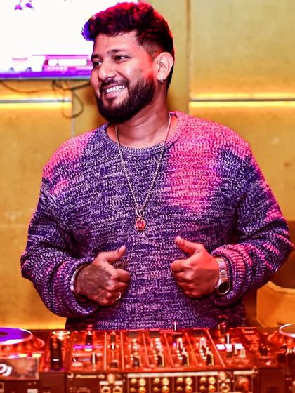 A happy moment behind the decks. Every smile has a story, and mine is written in music.