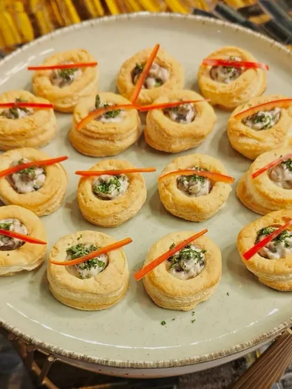 A platter of our creamy mushroom vol-au-vents. These flaky pastry cups are a classic and elegant appetizer, perfect for any gathering.