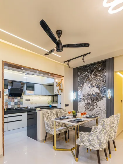 Here you can see the seamless transition from the dining area to the semi-open kitchen. This layout is great for entertaining, allowing for easy conversation and connection between the two spaces.