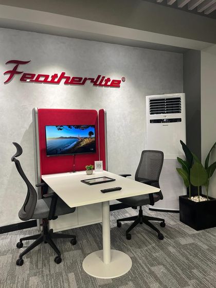 Another look at the Featherlite office, where our planters add a touch of nature to their modern furniture pods. A simple plant can make any workspace feel more inviting and productive.