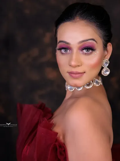 A beautiful portrait of the model in the red gown, her expression and pose exuding elegance and style.