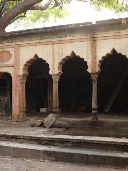 The haveli courtyard before restoration, showing the potential of the arched verandah and the need for careful repair.