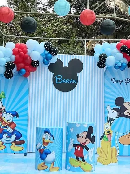 A classic Mickey Mouse and friends birthday party for Baran's third birthday. We used the iconic red, black, and blue color scheme with character cutouts of Mickey, Donald, and Pluto.