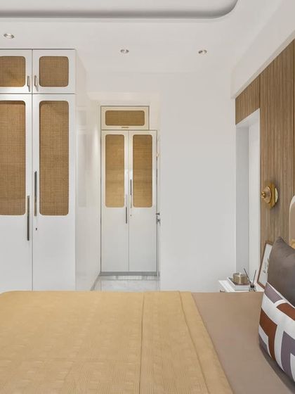 A charming detail from the parent's room: exquisite cane cupboards with a sleek white PU finish. This adds a touch of natural texture to the modern aesthetic while providing ample storage.