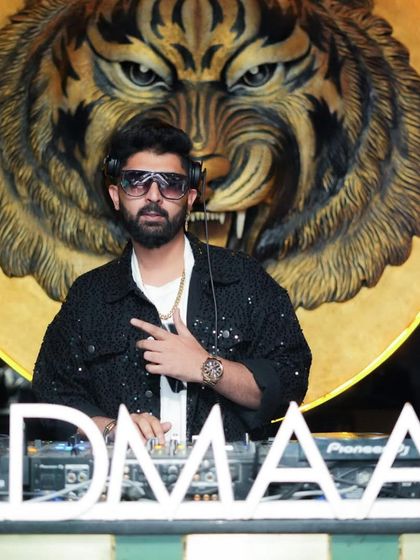 A powerful pose in front of the tiger logo, ready to own the night.