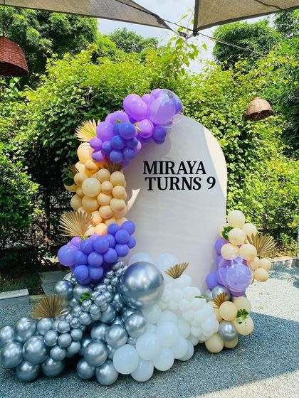 A close-up of the beautiful organic balloon garland against the custom backdrop.