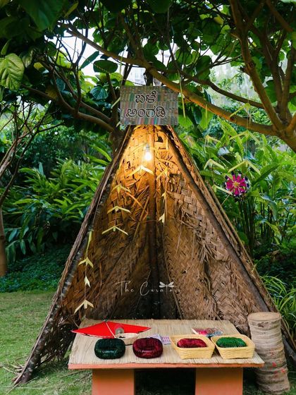 This photobooth is not just a backdrop, but an interactive experience, bringing a touch of village charm and nostalgia to the celebration.