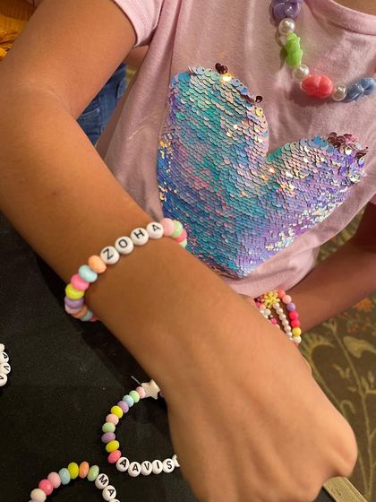 A close-up of a personalized name bracelet. These are always a favorite, as kids love wearing something that has their own name on it.