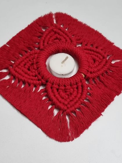 A vibrant red, heart-petal diya holder, perfect for adding a festive touch during Diwali or Valentine's Day.