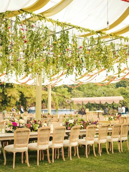 A garden of hanging florals. We created this enchanting overhead installation to hang above the dining tables, making the wedding lunch feel like an immersive, magical floral experience.