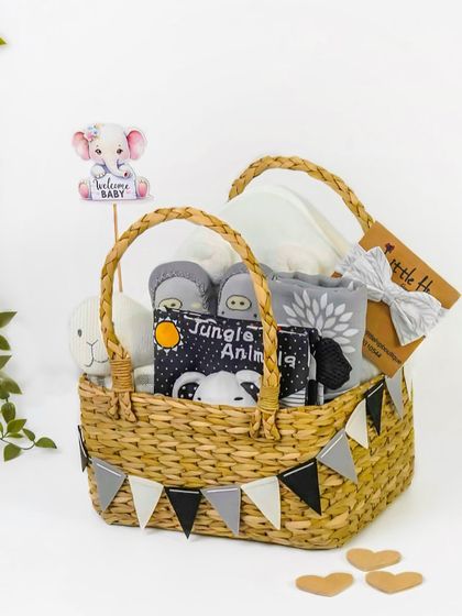 The polar bear themed items packed into a rustic wicker basket. This shows customers the final, assembled look of the gift hamper.
