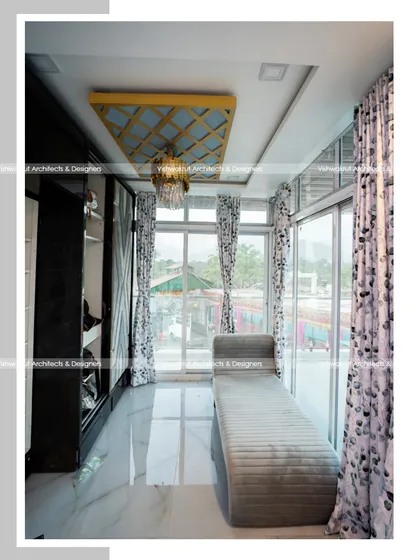 The walk-in closet and lounge area in the master suite. The design balances open space for relaxation with practical storage solutions, all while maintaining a connection to the outdoors through large windows.