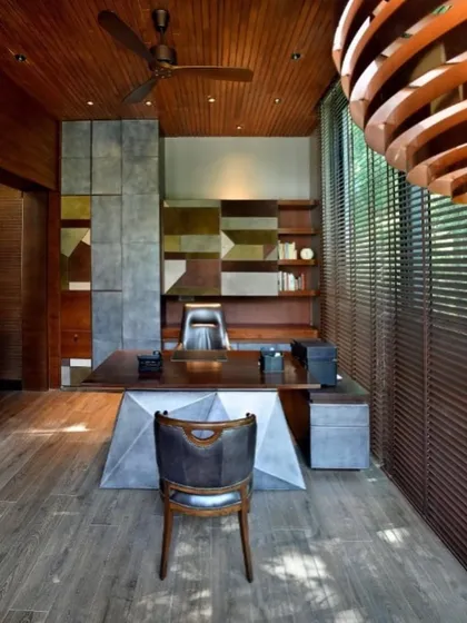 A straight-on view of the custom-designed desk and storage unit in the T House study, showcasing the geometric play of materials.