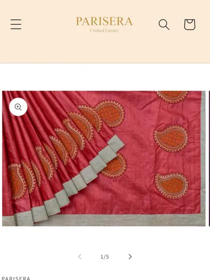 A screenshot showing one of my creations, a red tussar silk saree with embroidered paisley motifs, featured on the luxury craft platform Parisera.