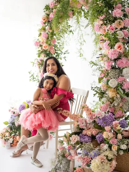 Another stunning mother-daughter duo from the Mother's Day minis. The vibrant pinks in their outfits look amazing with the floral backdrop.