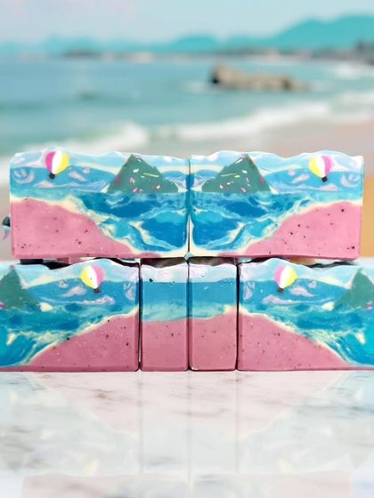 My beach-themed soaps set against a beautiful AI-generated beach background.
