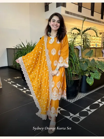 The Sydney Orange Kurta Set is all about bold color and beautiful details. The lace-edged dupatta adds a soft, feminine touch to this vibrant outfit.