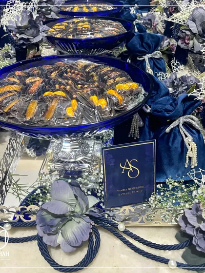 Color and craftsmanship come together in our Azure Crystal Bowl Hampers. The deep, radiant blue of the crystal bowl, paired with a silver-plated tray and luxurious velvet potlis, creates a stunning visual. This is a perfect example of how I blend traditional forms with a vibrant, modern aesthetic for wedding favors.