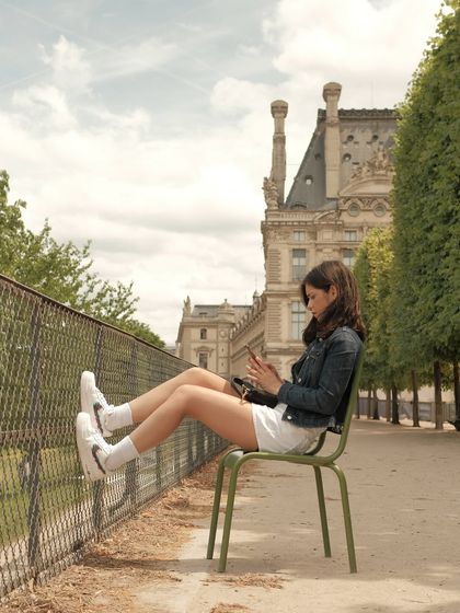 A creative shot from the Paris photoshoot, with the model showing off the custom sneakers.
