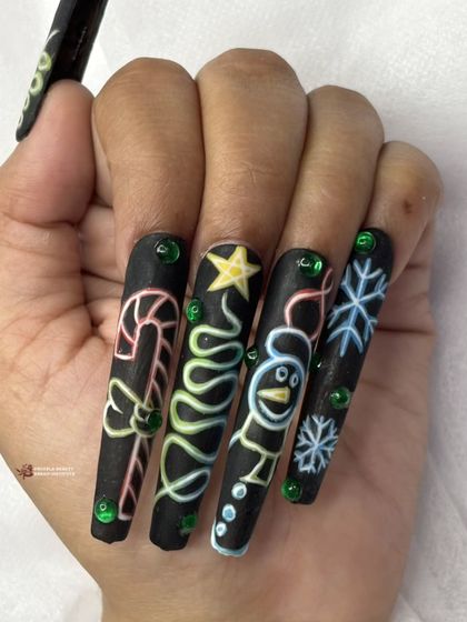 This image shows the full set of neon Christmas nails, including a candy cane, Christmas tree, snowman, and snowflake.