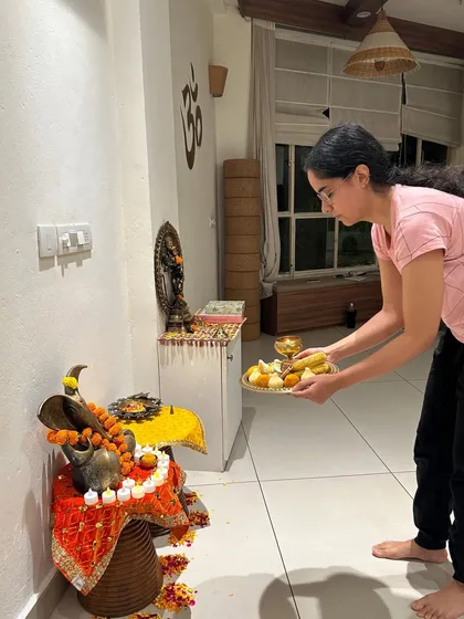 A young participant offers prayers during the Ganesh Chaturthi pooja. It is beautiful to see devotion being passed down and shared across generations within our community.