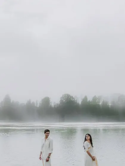 An artistic pre-wedding portrait taken by a misty lake. This image demonstrates our ability to create moody and atmospheric photographs that tell a different kind of love story.