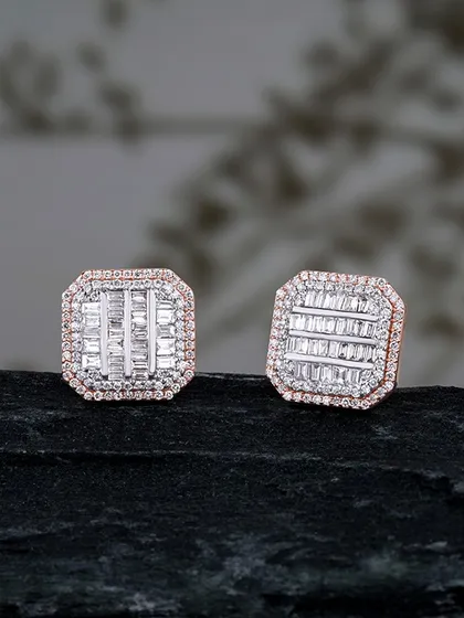 Crafted to shine, designed to captivate. These elegant stud earrings feature a mosaic of baguette and round diamonds, creating a modern and sophisticated sparkle. They are a perfect example of understated luxury.
