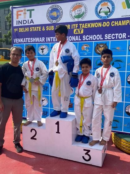 A group of our yellow-belt students sweeping the medals in their category at the Delhi State Championship.