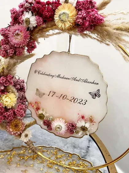A close-up of the personalized hanging sign with the couple's wedding hashtag and date.