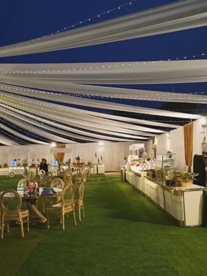 Picture this: an elegant outdoor reception under a canopy of flowing white drapes and twinkling fairy lights. I design the entire atmosphere to make your event feel magical, from the grand layout to the smallest detail.