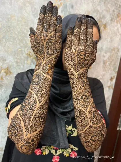 Shazeen's engagement henna, featuring a stunning tree-of-life design with floral branches and personalized initials.