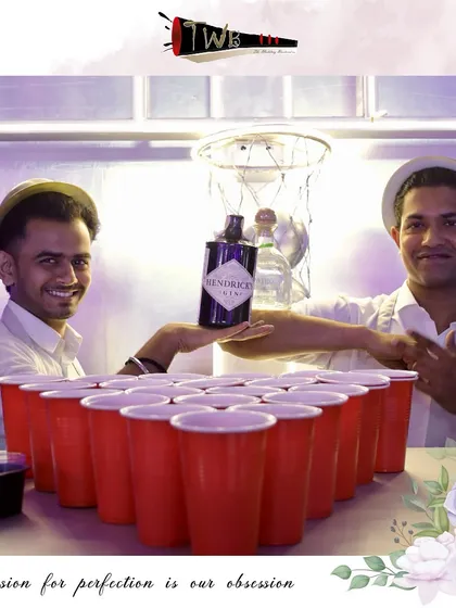 Our bartenders engaging in a game of beer pong, showcasing the fun and interactive elements we can bring to a party.
