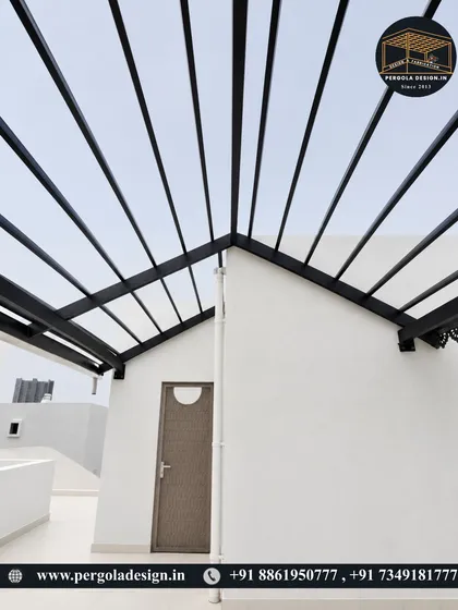 A straight-on view of the A-frame design of the black pergola, a modern take on a classic roof shape.