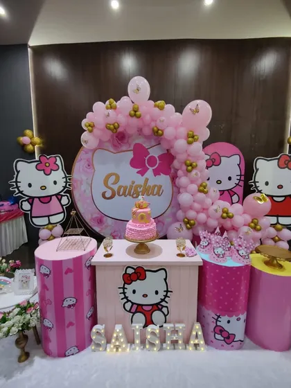 A cute and classic Hello Kitty themed party. The setup is all in pink, with a custom backdrop, themed bar counter and plinths, and character cutouts.
