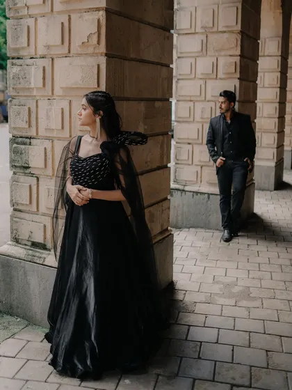 I love creating compositions that feel like a scene from a movie. Here, the bride is in the foreground while the groom is in the background, adding a sense of depth and narrative to the image.