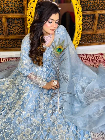 Another angle of this elegant look, showing how the soft makeup enhances the client's features without overpowering her natural beauty.