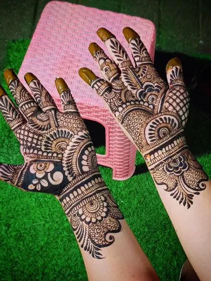 A dense and detailed Indian mehandi design, showcasing a variety of traditional patterns.