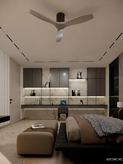 In this bedroom from our Meraki project, a built-in study nook with marble backing and integrated lighting provides a functional and stylish workspace. The design uses a palette of warm neutrals and dark wood for a contemporary, intellectual feel.