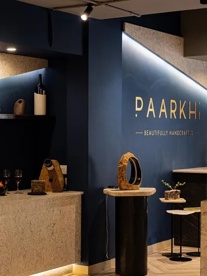 This image captures the sublime ambiance of the boutique, where the sleek lines of the bar and reception counters harmonise with the natural beauty of the stone materials. The lighting design was crucial in creating this serene and opulent feel.