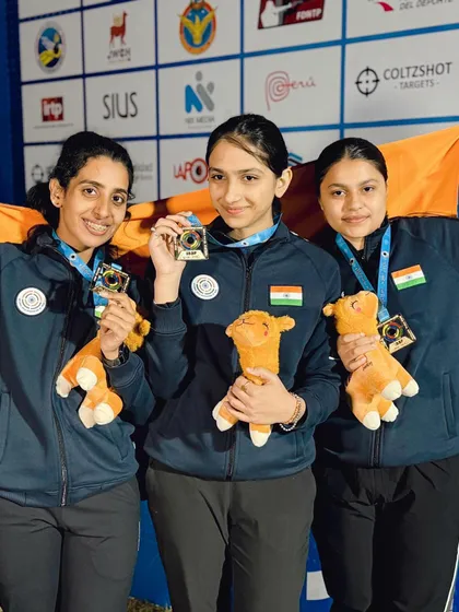 Our victorious junior women's team proudly displaying their medals at the ISSF World Championship. Their success is a testament to our focused training on advanced shooting techniques.